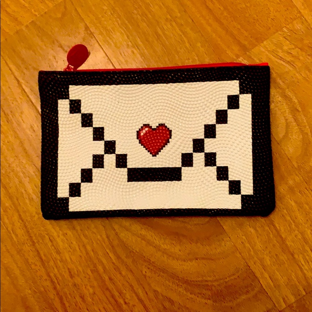 Completely new little make up pouch.